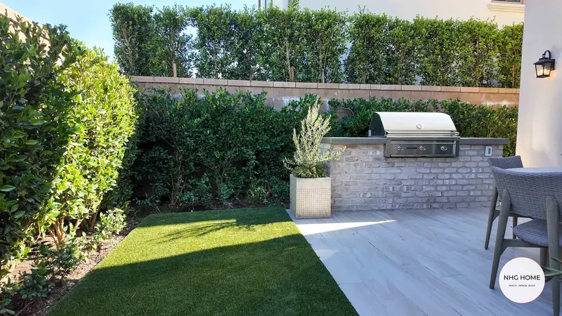 Built-in BBQ island with turf and porcelain pavers, NHG HOME project, Orange County