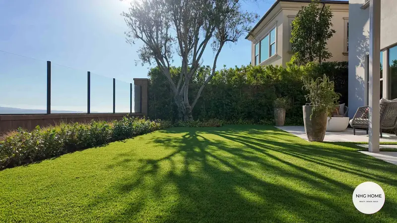 View lawn with glass railing and planting beds, NHG HOME project, Orange County